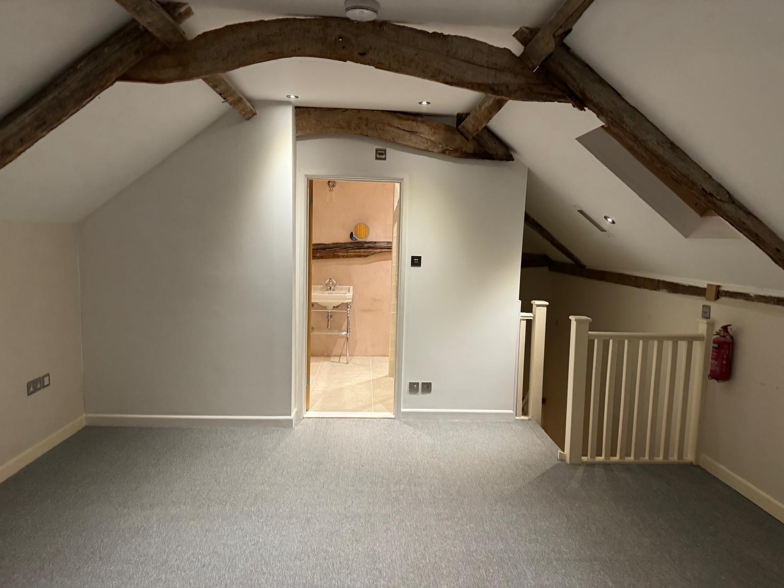 Loft conversion — new stud walls and framing going up