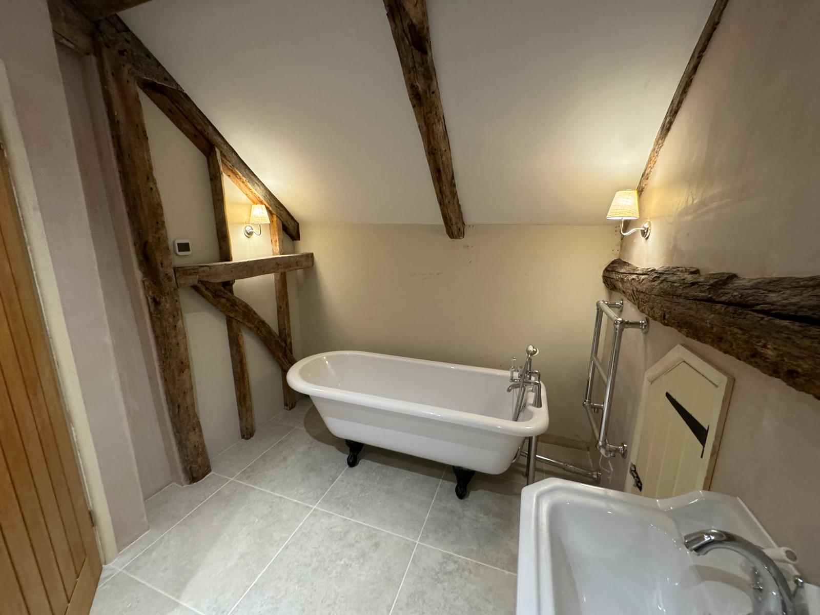 Loft conversion — finished en-suite with walk-in shower and toilet