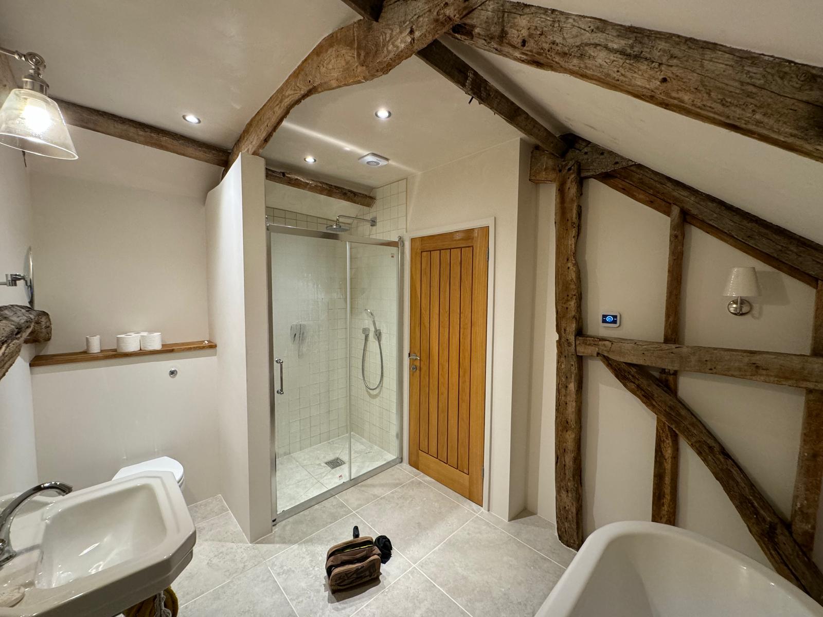 Loft conversion — finished en-suite with freestanding bath