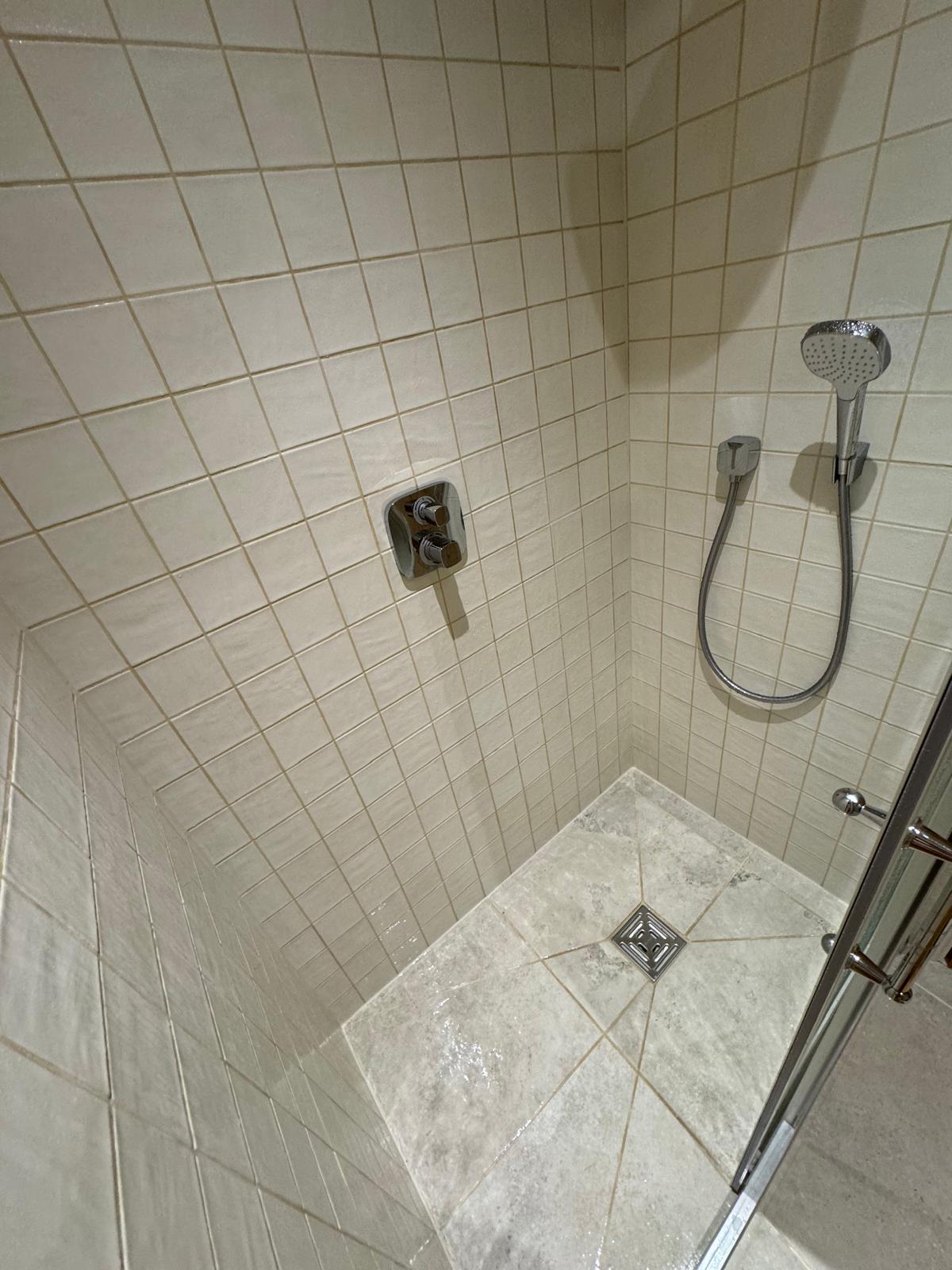 Loft conversion — finished en-suite bathroom with oak door