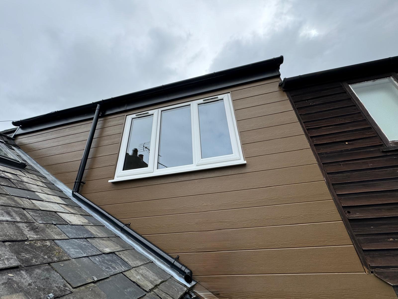 Loft conversion — finished dormer exterior with new cladding and window