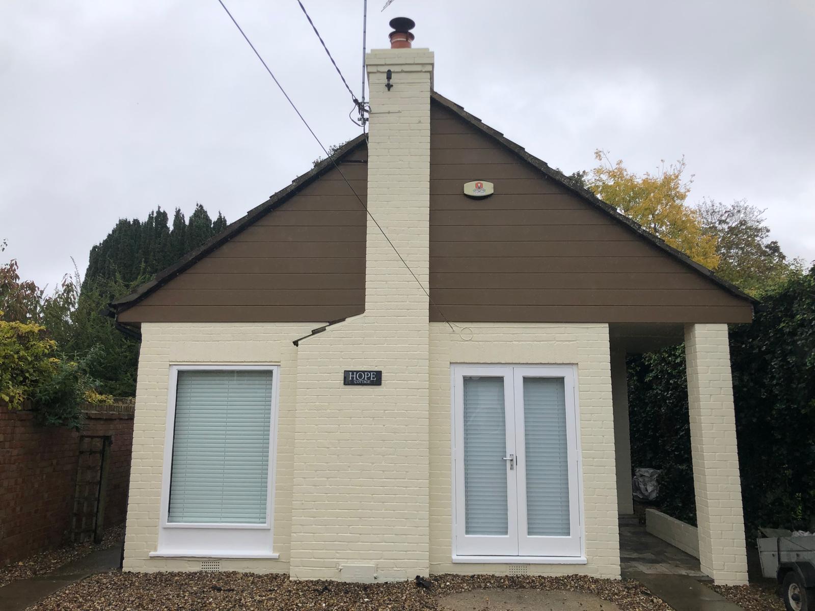 Maintenance — repainted gable and chimney